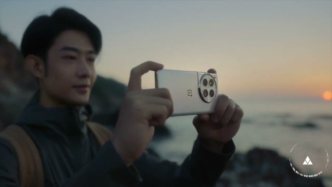 A character framing a photograph at sunset in a OnePlus film